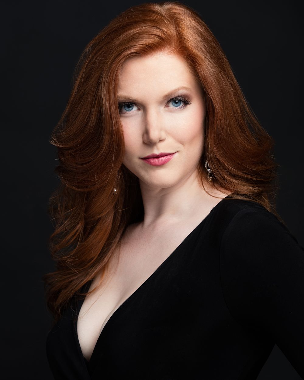 Theatrical actress headshot on a black backdrop, photographed at HeadshotDC in Washington, DC